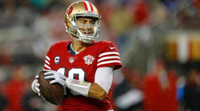 49ers quarterback Garoppolo drops back to throw a pass during a game vs. Indianapolis.